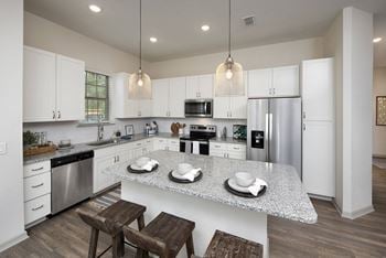 Stainless steel appliances with side by side fridge